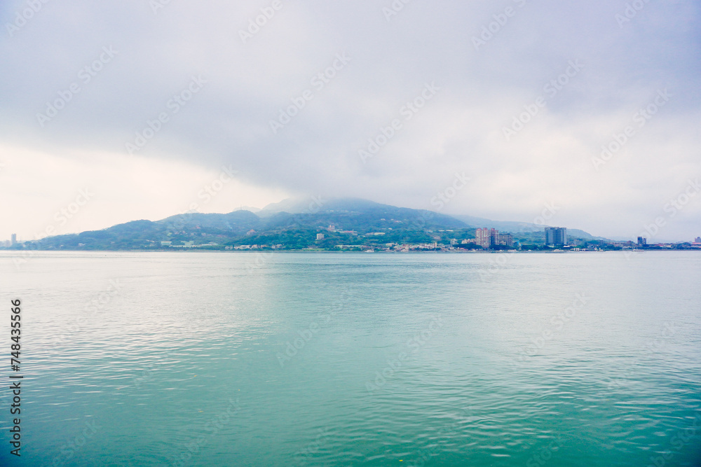 Taipei, Taiwan, Republic of China, 01 22 2024: Clean Tamsui river in a raining day in winter
