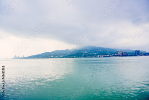 Taipei, Taiwan, Republic of China, 01 22 2024: Clean Tamsui river in a raining day in winter 