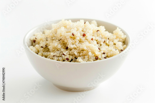 A bowl of cooked quinoa, pristine and fluffy, on white.