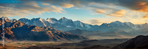 The Unparalleled Beauty of Afghanistan: A Serene Dance of Sunlit Mountain Ranges and Shadows © Bill