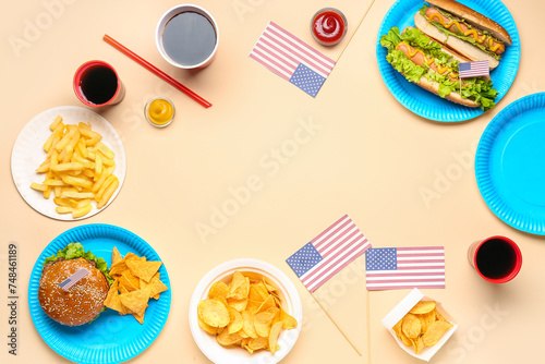 Frame made of tasty dishes, drinks and American flags on color background. Memorial Day celebration