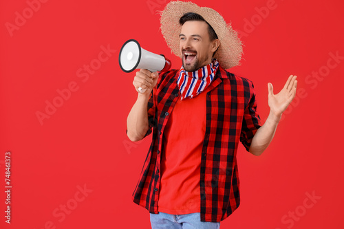 Handsome man shouting into ...