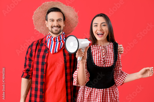 Young couple with megaphone...