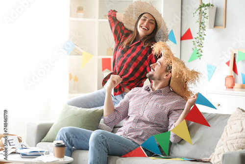 Young couple with flags cel...