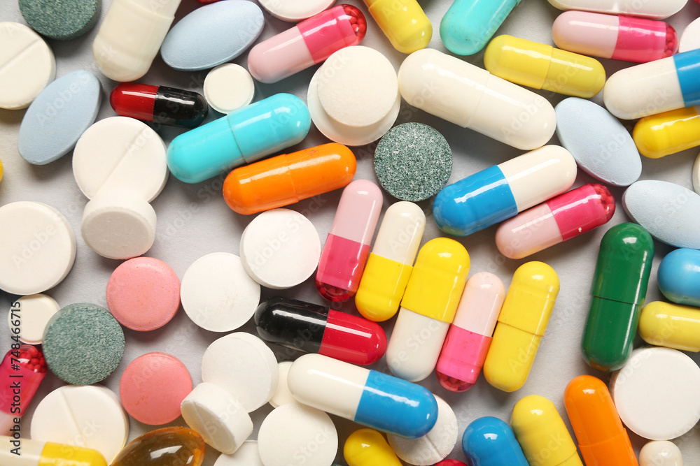 Different pills on grey background Different pills on grey background