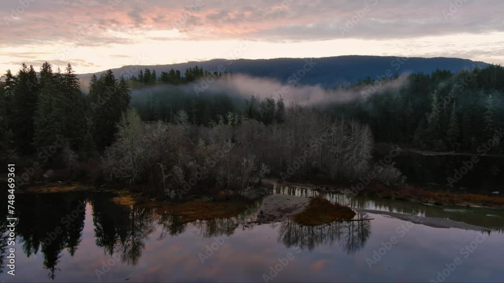 Fog Covered Trees by the Lake in Valley by Mountains. Canadian Nature Landscape. Aerial View, Background. Vancouver Island, BC Canada. Fog Covered Trees by the Lake in Valley by Mountains. Canadian Nature Landscape. Aerial View, Background. Vancouver Island, BC Canada.