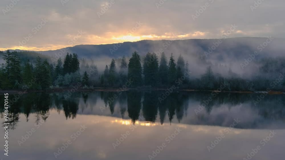 Fog Covered Trees by the Lake in Valley by Mountains. Canadian Nature Landscape. Aerial View, Background. Vancouver Island, BC Canada. Fog Covered Trees by the Lake in Valley by Mountains. Canadian Nature Landscape. Aerial View, Background. Vancouver Island, BC Canada.
