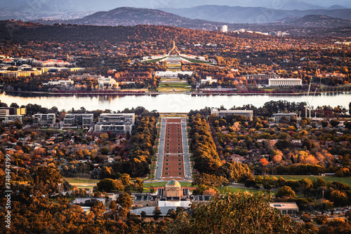 Fototapeta Naklejka Na Ścianę i Meble -  A panorama view of the Parliament House and the city of Canberra from Mount Ainslie Lookout in the dusk in autumn