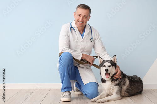 Male veterinarian with cute...