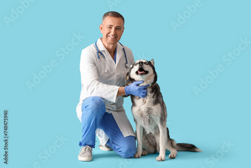Male veterinarian with cute...