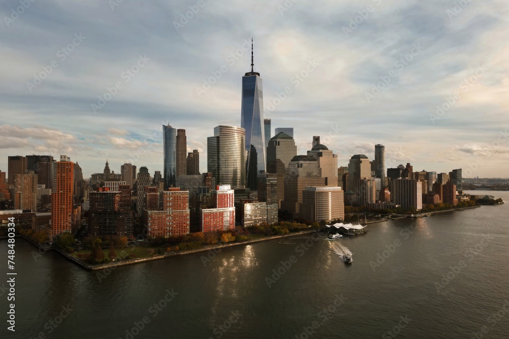 New York skyline from drone. New York over the Hudson river. Manhattan NYC cityscape, aerial view. New York Manhattan downtown skyline. New York skyscrapers over Hudson river.
