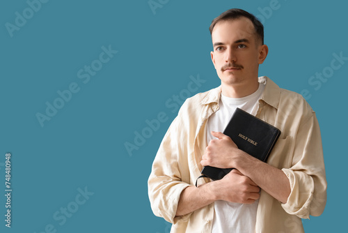 Young man with Holy Bible p...