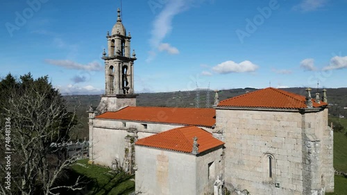 Drone ascends establishing Santa Maria de Castrelo Church in San Xoan de Rio, Ourense, Galicia, Spain photo