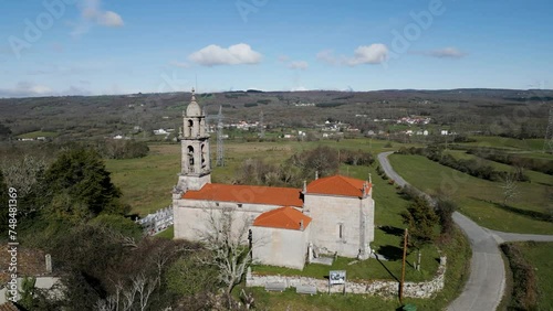 Santa Maria de Castrelo Church in San Xoan de Rio with beautiful bell tower carved from stone photo