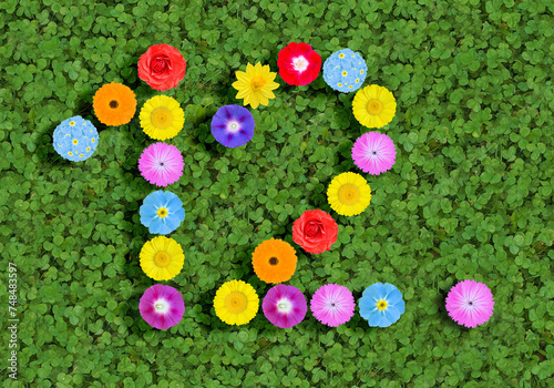 Obraz na plátně number written with colorful flowers on green clover background