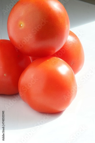 Fresh tomatoes in natural light.