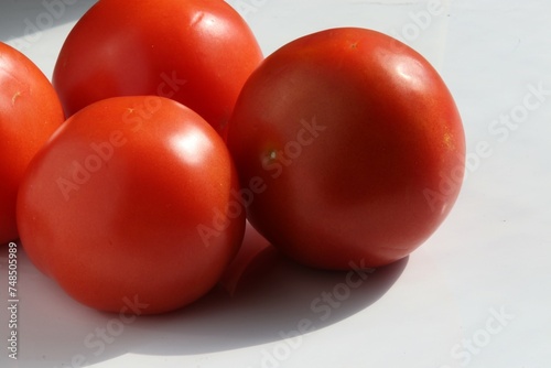 Fresh tomatoes in natural light.