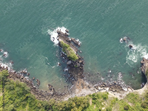 Unveiled from Above: A Drone's Perspective on Karang Agung Beach's Breathtaking Sunset