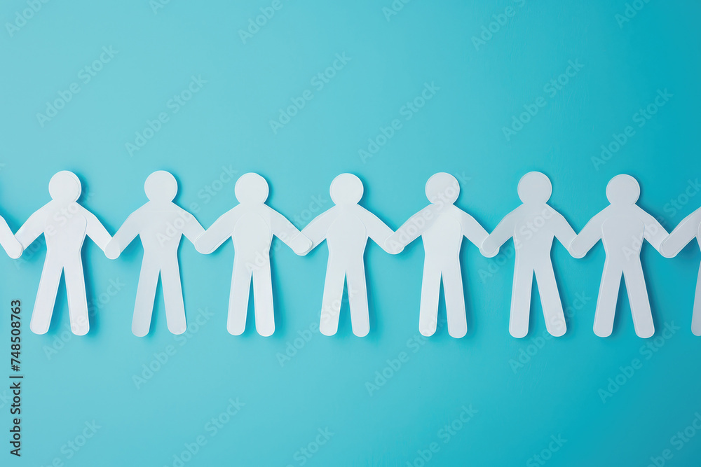 Paper men holding hands. A symbol of friendship, team, unity Paper men holding hands. A symbol of friendship, team, unity