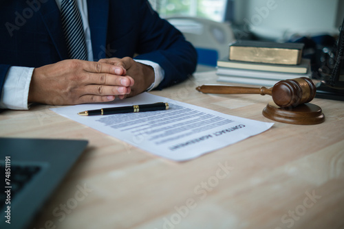 A judge gavel is prepared in the courtroom to be used to give a signal when the verdict is read after the trial is completed. Concept judge gavel is prepared to symbolize the decision in a court case. photo