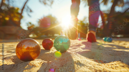 People playing boules on sand with colorful balls on summer holidays photo