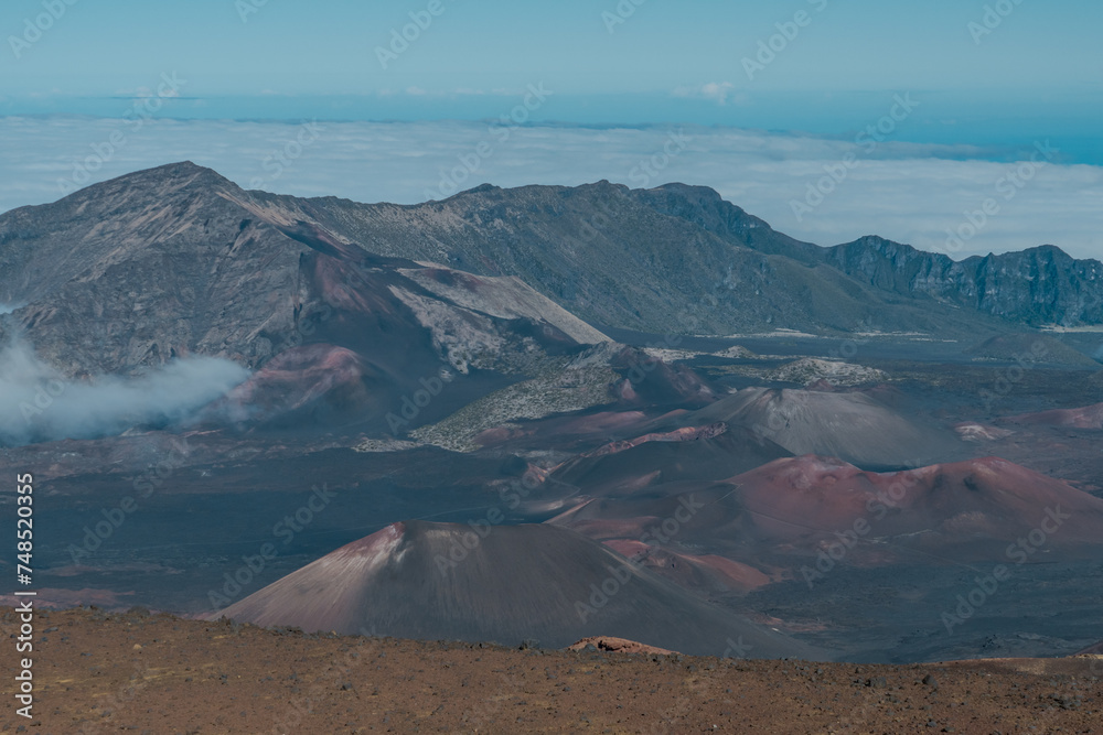 Fototapeta premium Cinder cone at Haleakala crater or the East Maui Volcano, is a massive, active shield volcano that forms more than 75% of the Hawaiian Island of Maui.