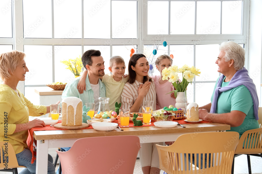Big family having Easter dinner in kitchen - obrazy, fototapety, plakaty 