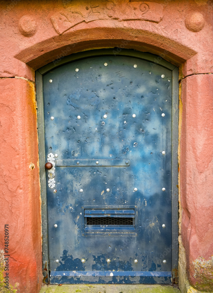 Old weathered metal door.
