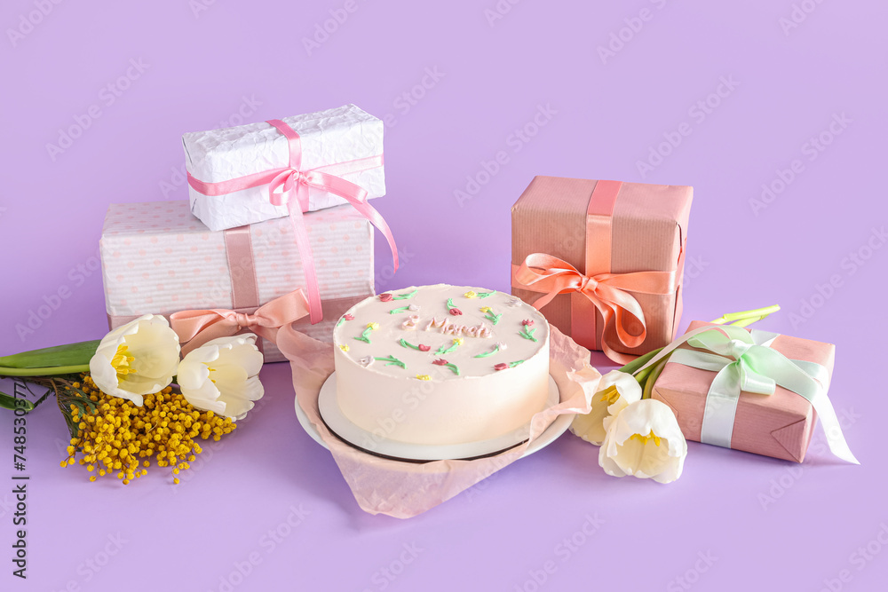 Sweet bento cake with gift boxes, beautiful tulips and mimosa flowers on lilac background. International Women's Day Sweet bento cake with gift boxes, beautiful tulips and mimosa flowers on lilac background. International Women's Day