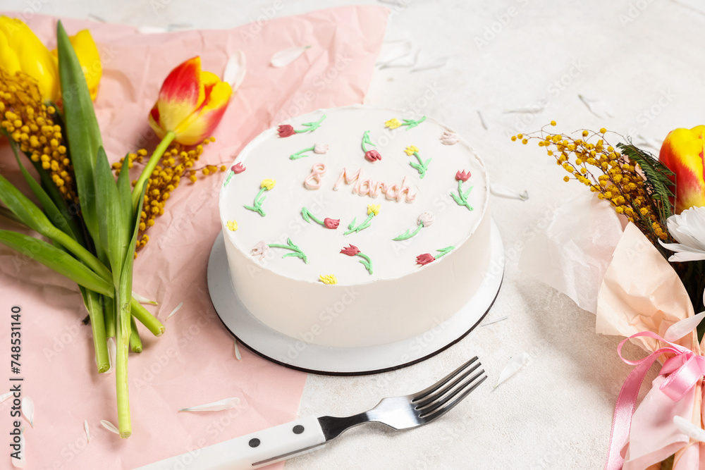 Sweet bento cake and beautiful flowers on white background. International Women's Day Sweet bento cake and beautiful flowers on white background. International Women's Day
