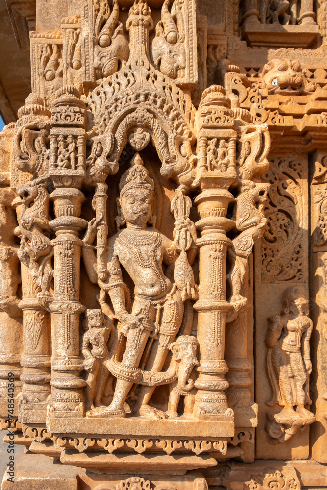 Ancient bas-relief of famous Neminath Jain temple in Ranakpur, Rajasthan, India