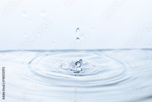 Captivating shot of a pristine water droplet reflecting light, symbolizing purity and clarity. Ideal for environmental campaigns or wellness-themed designs.