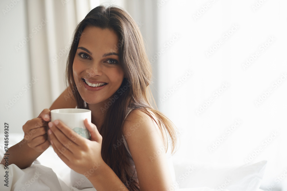 Smile, portrait and woman with coffee in bedroom with caffeine to wake up in morning at home. Happy, relax and comfy young female person drinking mug of cappuccino, espresso or latte in apartment. Smile, portrait and woman with coffee in bedroom with caffeine to wake up in morning at home. Happy, relax and comfy young female person drinking mug of cappuccino, espresso or latte in apartment.