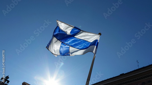 Finnish flag flying over Helsinki Railway station