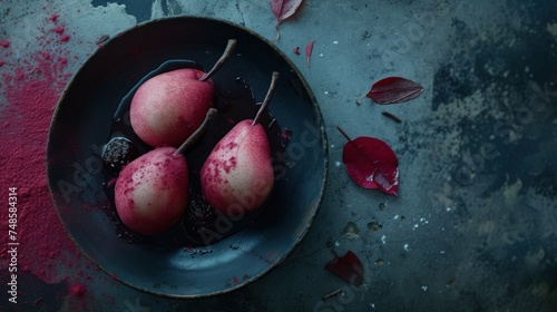 a bowl filled with three pears on top of a table next to leaves and a red substance on the ground. photo