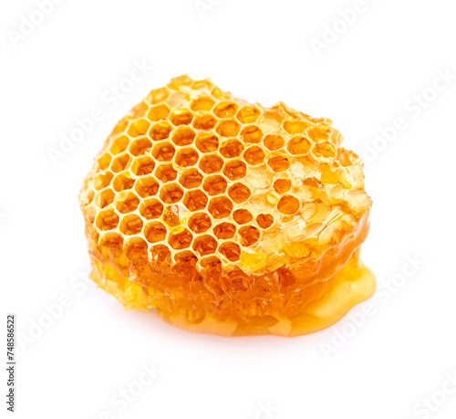 Honeycomb with honey on white backgrounds