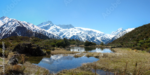 Southern Alps and Aoraki Mt Cook reflecting in the pristine Sealy Tarns on a beautiful day on New Zealand's South Island © QuiBee