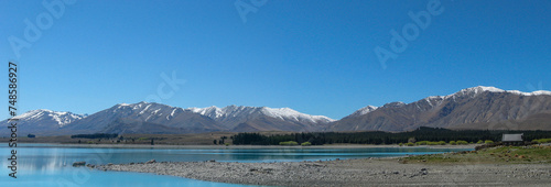 Panoramic view of the Church of the Good Shepherd with Lake Tekapo and Southern Alps mountain range on New Zealand's South Island