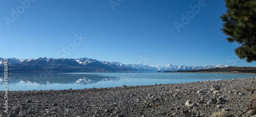 Spectacular view of turquoise Lake Pukaki with Aoraki Mt Cook and snow-capped Southern Alps mountain range on New Zealand's South Island