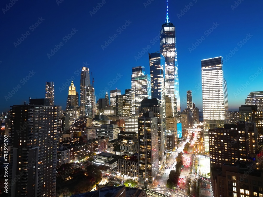 New York City, Manhattan famous top view. Night Manhattan from above. Manhattan panorama at sunset. NYC skyline at twilight. New York famous building. Night traffic in NYC. Lower Manhattan.