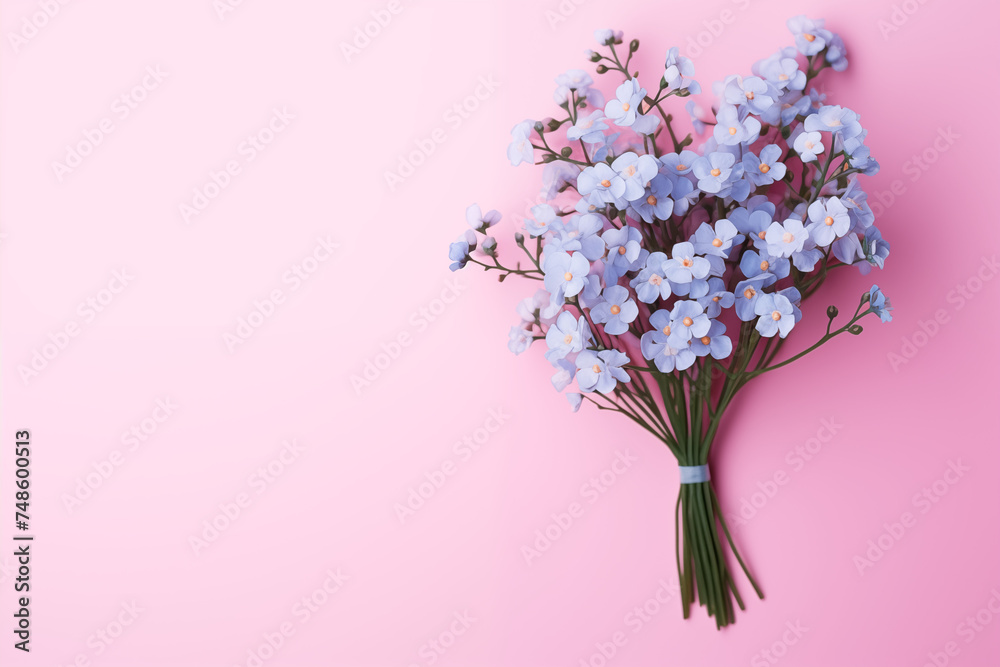 A bouquet of Forget-me-not on a simple light pink background
