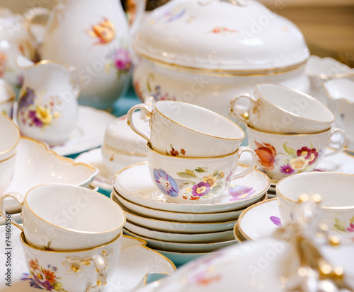 Antique French porcelain set with flowers and gold antiques