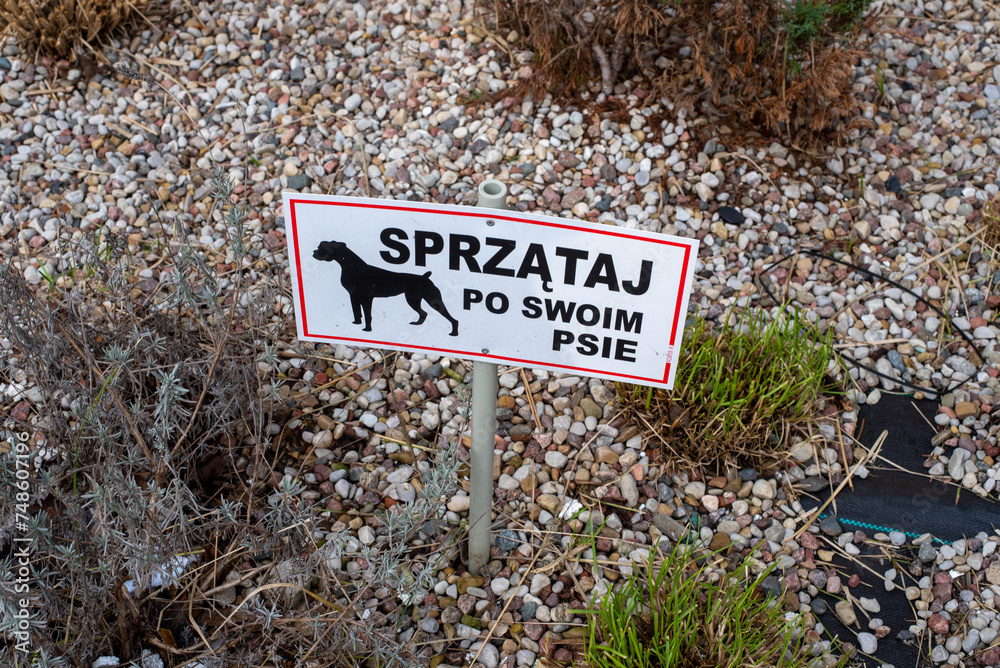 Sign in Polish: clean up after your dog