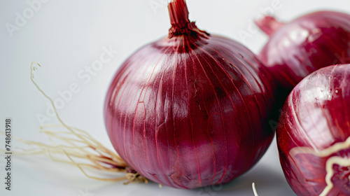 close up of two red onion with white background