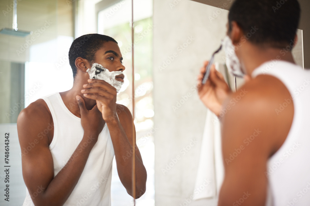 Mirror, shaving or grooming and black man in bathroom of home with razor for morning hair removal. Face, skincare and reflection of young person with foam to shave beard for hygiene routine Mirror, shaving or grooming and black man in bathroom of home with razor for morning hair removal. Face, skincare and reflection of young person with foam to shave beard for hygiene routine