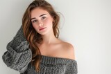 Pretty Young Woman in Off-the-Shoulder Sweater Dress photo on white isolated background