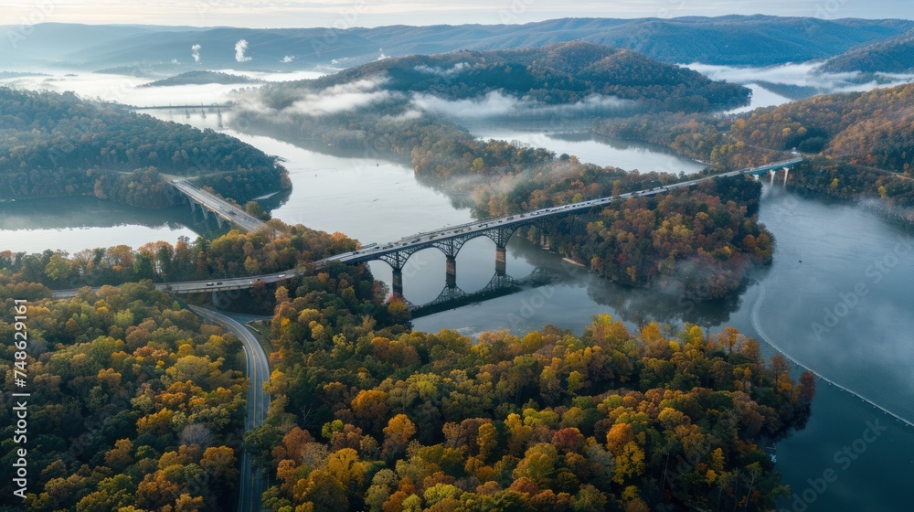Fototapeta premium Aerial view of a large bridge crossing a beautiful forest. 