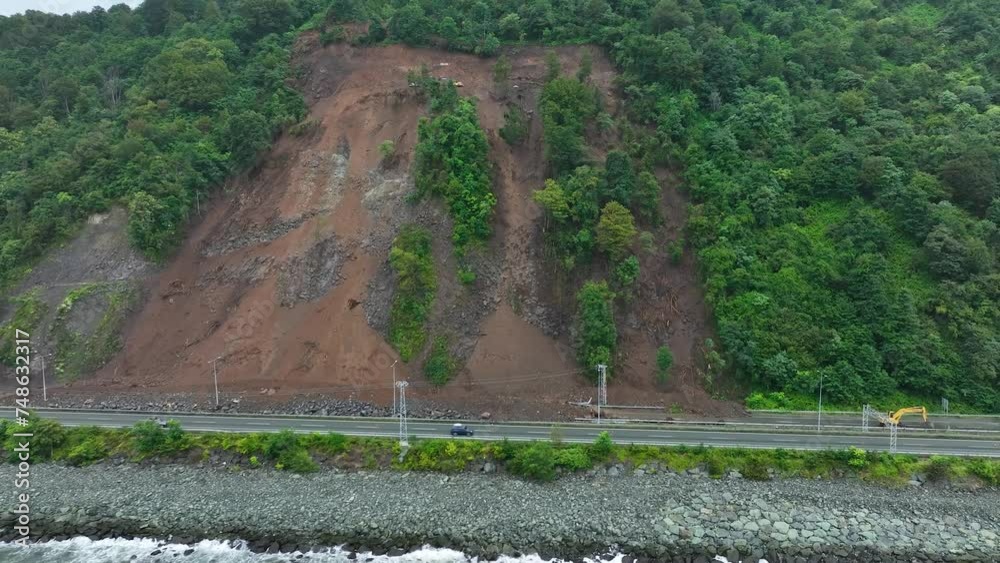 Mountain soil collapse in half of the highway. Landslides due to heavy ...