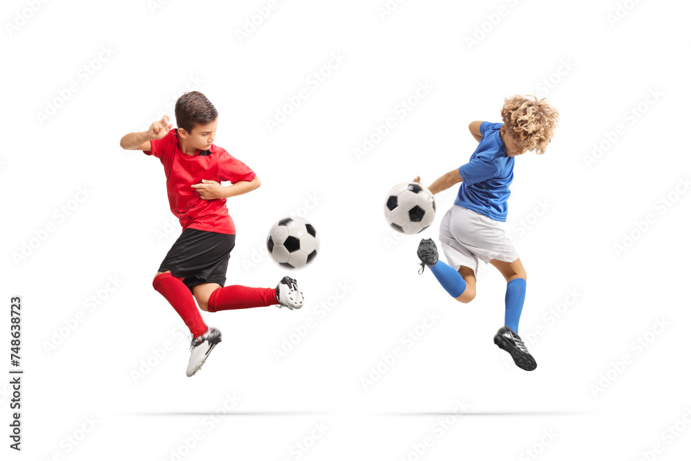 Boys kicking a football with back heel