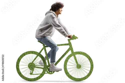 Guy riding a green eco-friendly bicycle